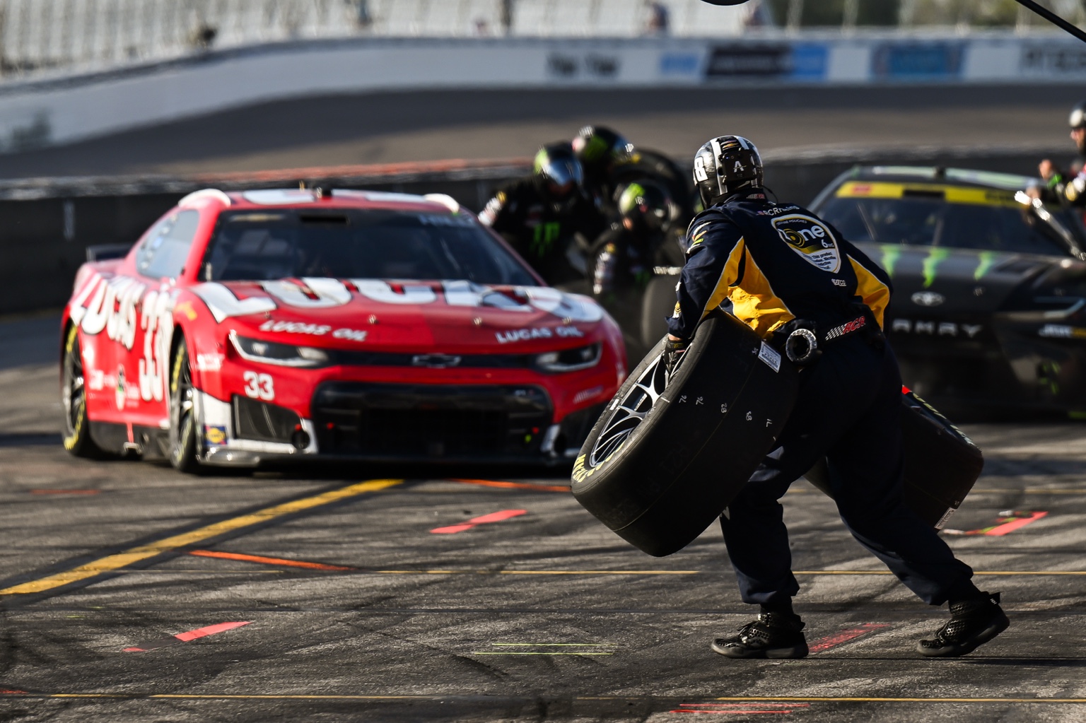 Connor Hamilton photographing from a professional motorsports pit lane