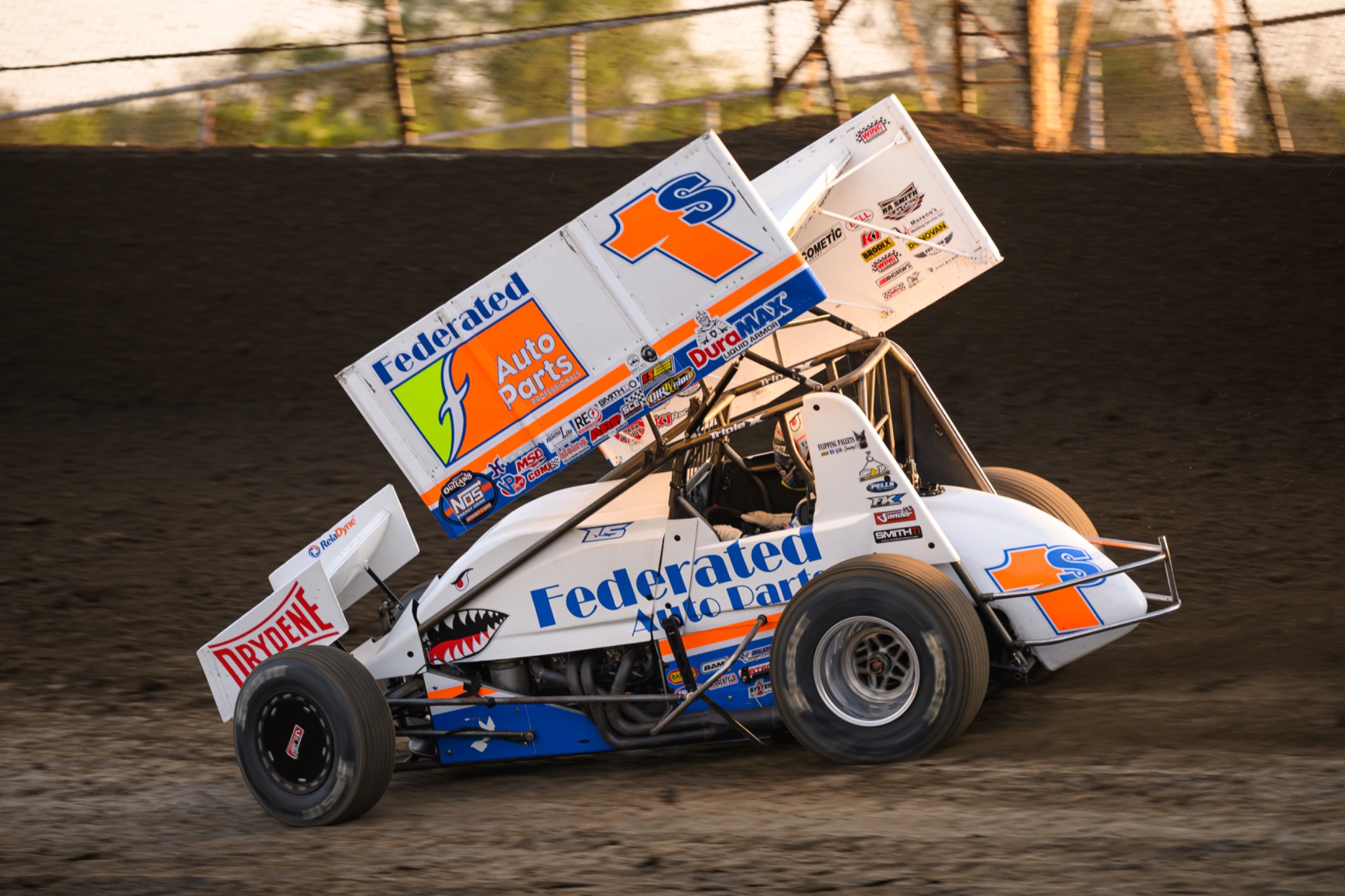 Sprint car competing on a dirt track